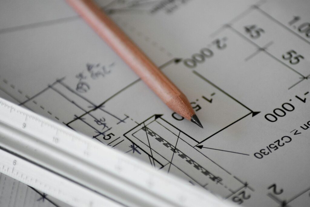 Blueprints with a pencil
