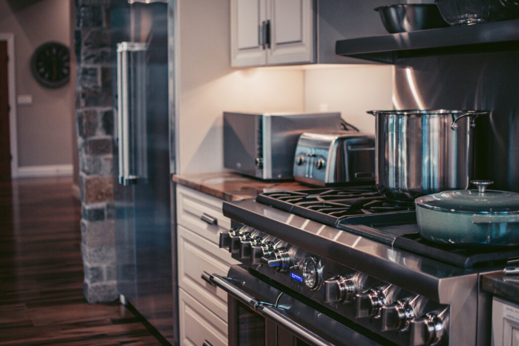 Stylish modern kitchen showcasing stainless steel appliances and elegant decor.